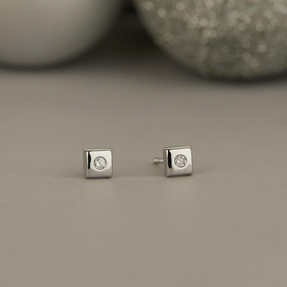 A SCHOOL GIRL'S DIAMOND (WHITE GOLD) EARRINGS FOR BABY GIRL