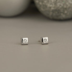A SCHOOL GIRL'S DIAMOND (WHITE GOLD) EARRINGS FOR BABY GIRL